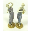 A pair of Royal Worcester porcelain figurines, circa 1928, modelled as music and dance, with a Greci... 