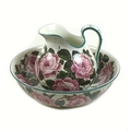 A Wemyss Ware jug and bowl wash set, early 20th century, painted with roses, printed, painted and im... 