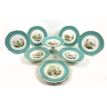 A Victorian part dessert service, possibly Coalport, decorated with Scottish castles in gilt scroll ... 
