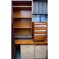 An office desk, a set of shelves and a book case. (3)