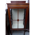 An Edwardian mahogany and inlaid display cabinet, with two glass shelves, with key.