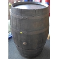 A French oak coopered barrel, with stained finish and black painted metalwork.