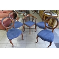 A set of four Victorian balloon backed dining chairs, carved detailing to frames, together with Vict... 