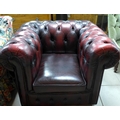 A Victorian Chesterfield style red leather armchair.