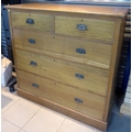 An early 20th oak chest of drawers with two over three graduating drawers, together with a spare set... 