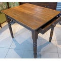 An early to mid 20th century table with single drawer and turned legs.