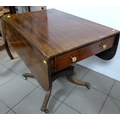 A Regency style mahogany sofa table, single drawer with brass knobs, raised on square section column... 