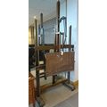 A large floor standing artist's easel, with counter-weighted rise and fall action, twin feet with ca... 