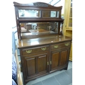 A late Victorian mahogany and rosewood sideboard, the three panelled mirrored back with turned and c... 
