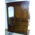 An Edwardian mahogany, line inlaid and crossbanded compactum, outswept cornice over a single bevelle... 