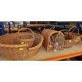 A collection of baskets, comprising a dog bed, a cat basket and three shopping baskets. (5)