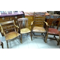 A collection of four 19th century chairs, one a mahogany ladder back carver with leather seat, two k... 