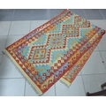 A vegetable dyed Chobi Kelim runner, with triangular patterned all over design in green, orange, red... 