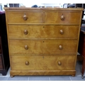A Victorian mahogany chest of two over three drawers with turned handles.