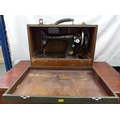 Vintage Singer sewing machine, complete with accessories and case.