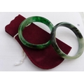 Two modern glass bangles, made to look like apple and spinach jade. (2)