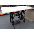 An Edwardian Jones cast iron sewing machine table, black painted with cast maker's name, with later ... 