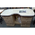 A cream painted twin pedestal dressing table with glass top above six drawers and complete with flor... 