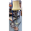 A brass standard lamp styled as a Corinthian column, on square base and four feet, complete with sha... 