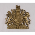 A brass wall plaque depicting the Royal Coat of Arms of the United Kingdom, 17 by 17cm.