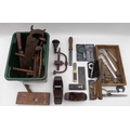 A collection of vintage woodworking tools and guages, including a rabbit or plough plane, an early h... 