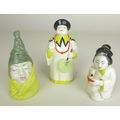 A group of three Royal Worcester candle snuffers comprising Mandarin, Japanese girl with a tangerine... 