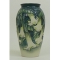 A limited edition Moorcroft pottery vase, Angels trumpet pattern, depicting cream flowers on green g... 