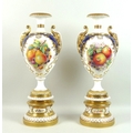 A pair of large modern Royal Worcester pedestal vases, foliate clasped twin handles, decorated in a ... 