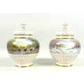 A pair of modern Royal Worcester potpourri vases and pierced covers, decorated by M. Powell in ‘Spri... 