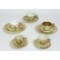 A group of Royal Worcester blush ivory tea cup sets, all with moulded decoration, comprising a trio ... 