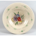 A Clarice Cliff for Wilkinson Ltd charger, decorated with chrysanthemums, spring flowers and clouds ... 