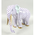 A modern Herend model of an elephant, modelled in standing pose, its hide decorated in a purple scal... 