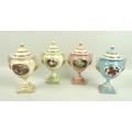 A set of four modern Royal Worcester pedestal vases and covers, with twin moulded handles supported ... 