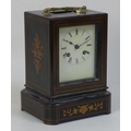 A French 19th century ebonised and marquetry inlaid oak cased mantel clock, with gilt metal carry ha... 