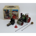 A Mamod steam traction engine, complete with original accessories, instructions and box.