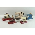 A group of five vintage child's toy sewing machines, three Little Betty, and two Vulcan, largest 18c... 