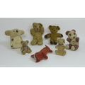 A group of vintage stuffed toys, comprising two teddy bears, a small jointed bear, a panda with gree... 