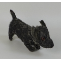 A Peacocks soft toy dog, circa 1930, with dark grey plush hair, sewn nose, and one remaining eye, la... 