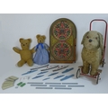 A group of vintage toys comprising a Pedigree Soft Toys Ltd push along ride on dog, 60 by 25 by 61cm... 