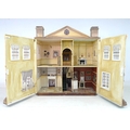 A large and impressive Queen Anne style doll's house, hand made and painted, the pediment above with... 