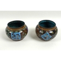 A pair of Chinese cloisonne enamel squat vases, 19th century, unmarked, each 9.5 by 7cm. (2)