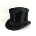 An Edwardian black silk top hat, by hatters A Pellett, Manchester, 55cm internal circumference, 17cm... 