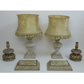 A pair of 19th century giltwood carved candlesticks with lobed bases, 16 by 23cm, together with a pa... 