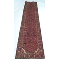 A Hamadan rug with red ground, #5629, 395 by 100cm.