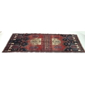 A Hamadan rug with red ground, #5589, 290 by 95cm.