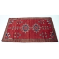A Baluchi rug with red ground, #5604, 203 by 110cm.