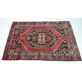 A Hamadan rug with red ground, #5602, 197 by 120cm.