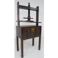 A 19th century oak table top book or linen press with two drawers below, raised on square section le... 