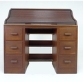An early to mid 20th century tambour fronted bureau, with fitted top and three drawers to each pedes... 
