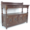 A Victorian buffet sideboard by Gillows, with upper tier shelf with two frieze drawers on column sup... 